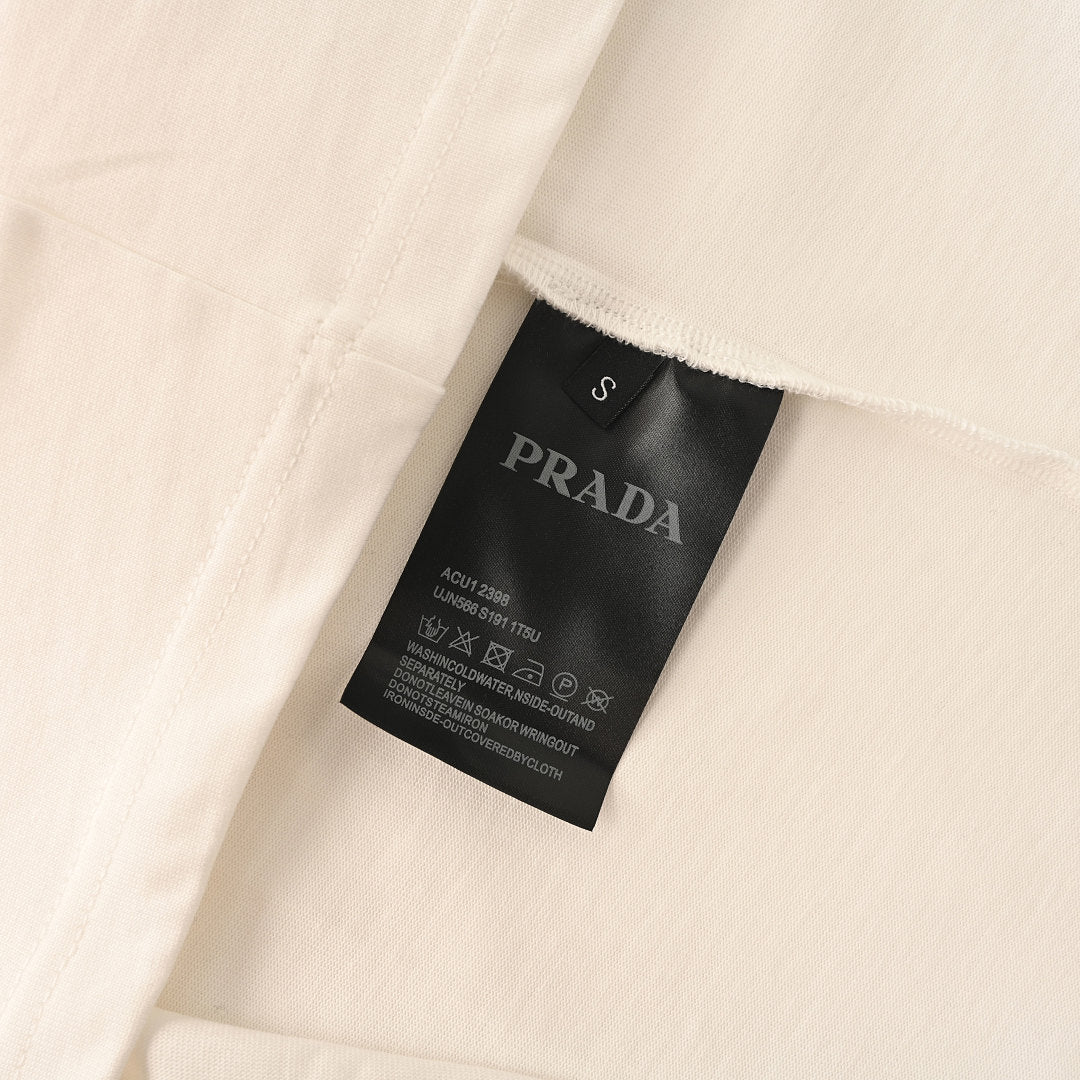 PRADA T-shirt with small figure graphic at the neckline